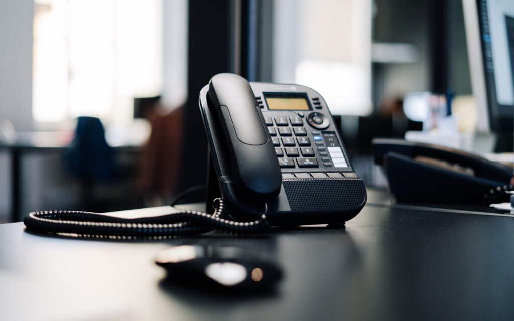 Big switch off header with phone on office desk