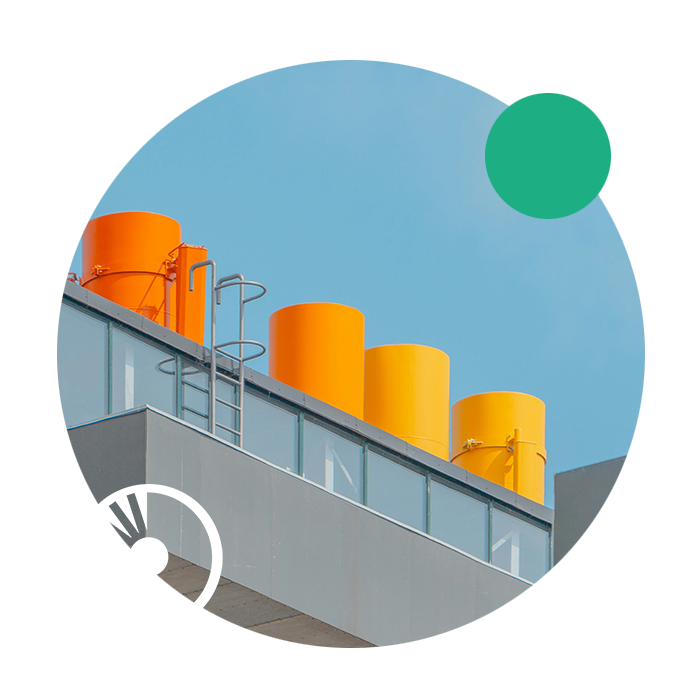 A yellow industrial chimney demonstrates TCR's link to large energy consuming businesses