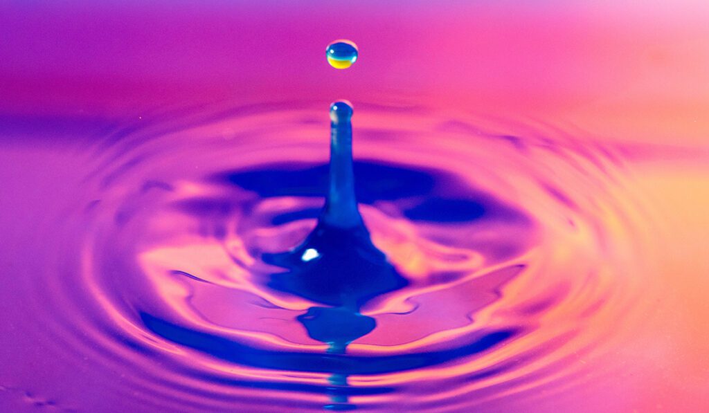 Drop of water in a stylised pink pool